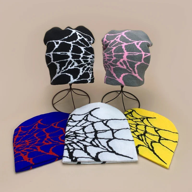 Five wool knitted hip hop beanies with bold spiderweb patterns in black white gray pink blue red yellow for autumn winter