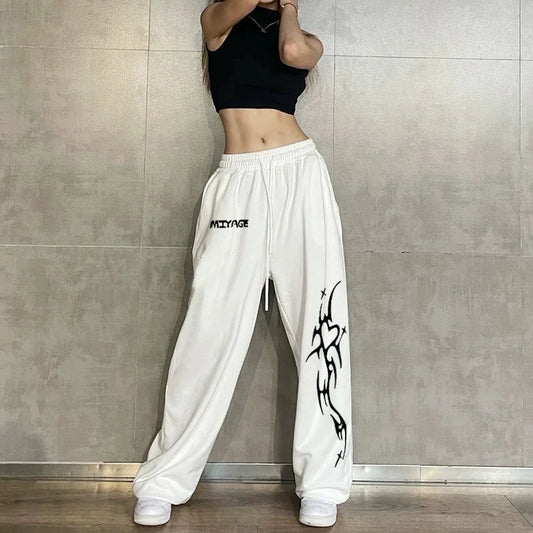 White cotton hip hop women casual dance sweatpants with black tribal graphic and mizyage branding for spring autumn streetwear