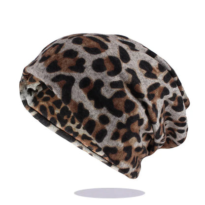 A soft slouchy autumn cotton beanie with classic women fashion leopard print in black and tan on a light gray base