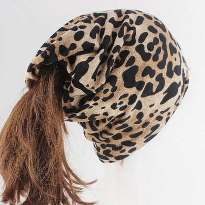 A soft stretchy tan and black women fashion leopard print autumn cotton beanie with a gathered front for hip hop women