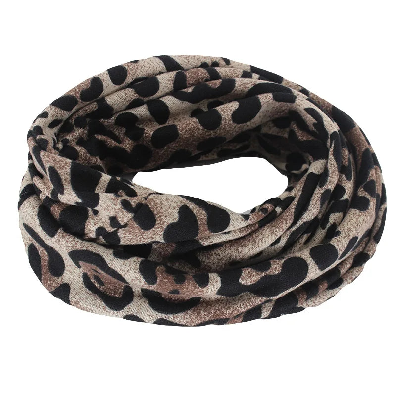 A soft stretchy infinity scarf with bold black and beige leopard print for hip hop women autumn cotton beanies style