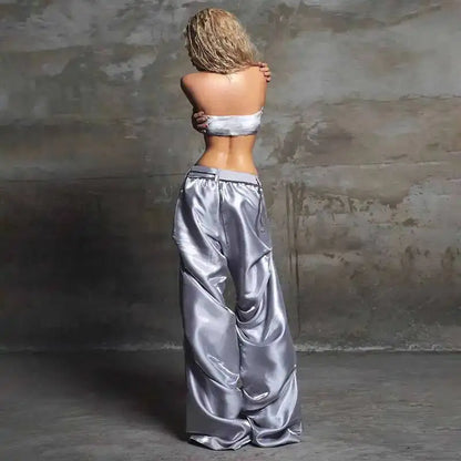 Silver satin wide-leg pants with high waist and drawstring detail suitable for street and casual hip hop style