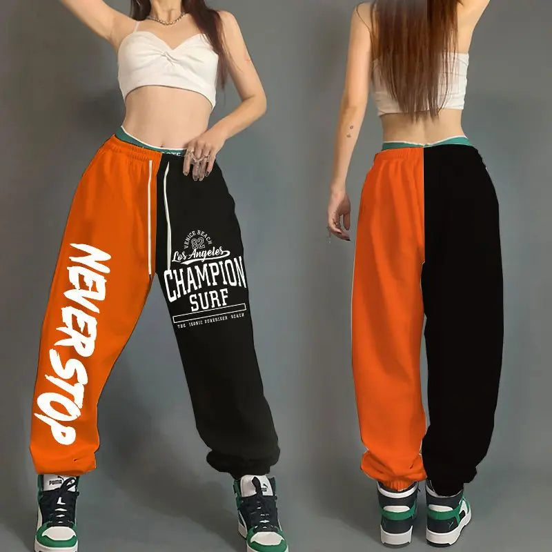 Orange and black split-leg streetwear dance sweatpants with never stop print and pockets cotton loose for hop women streetwear