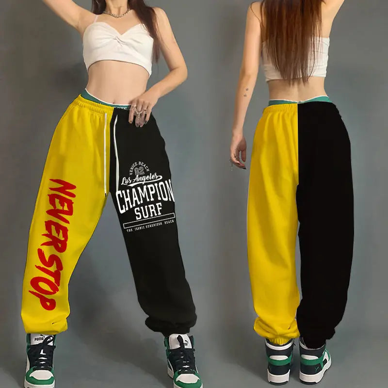 Yellow and black split-leg hop women streetwear sweatpants with pockets cotton loose fit and red and white lettering designs