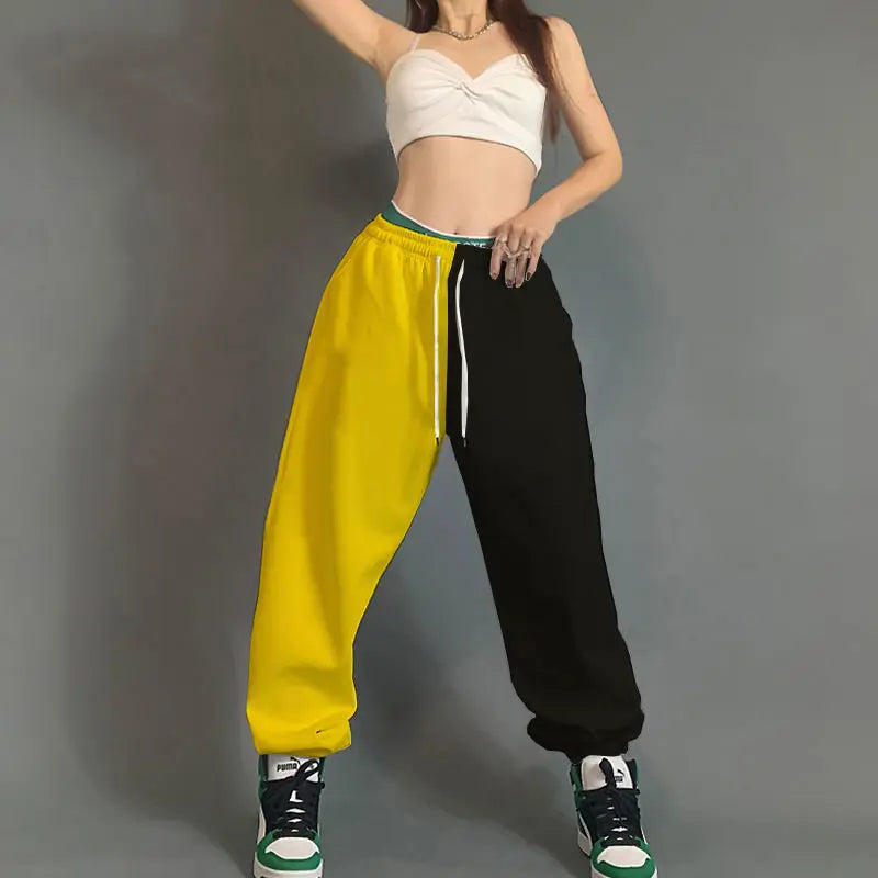 Vibrant yellow and black hip hop women streetwear dance sweatpants with green waistband trim pockets cotton loose fit