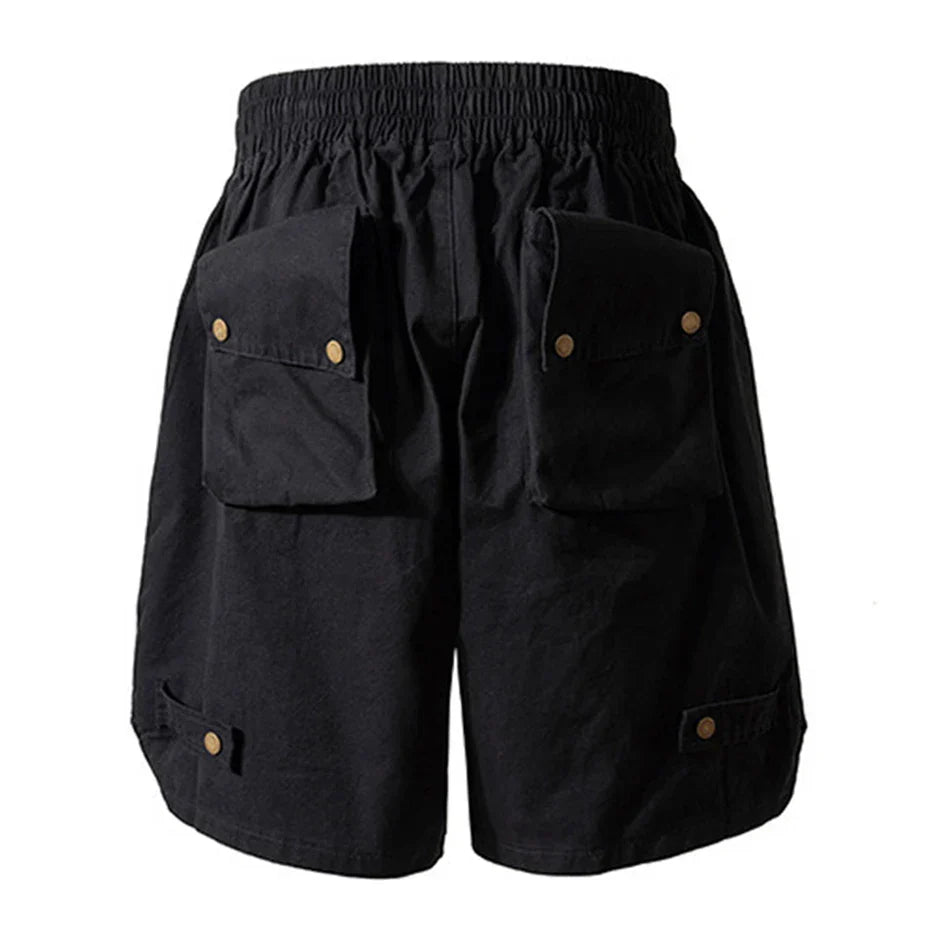 Black hip hop y2k streetwear cargo shorts with elastic waistband and multiple pockets secured by brass buttons