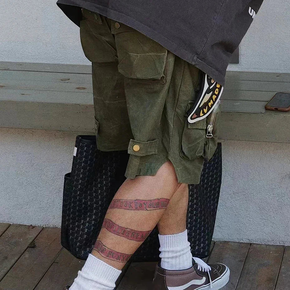 Black goyard tote bag with repeating diamond pattern paired with hip hop y2k streetwear cargo shorts