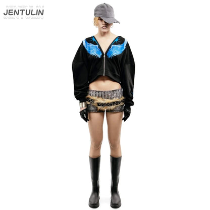 Black zip-up hoodie with vibrant blue wing embroidery across shoulders for winter streetwear and goth fashion