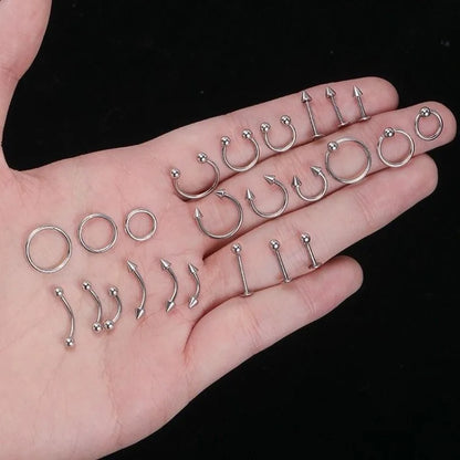 A collection of silver-toned hiphop stainless steel nose ring septum and horseshoe body jewelry pieces