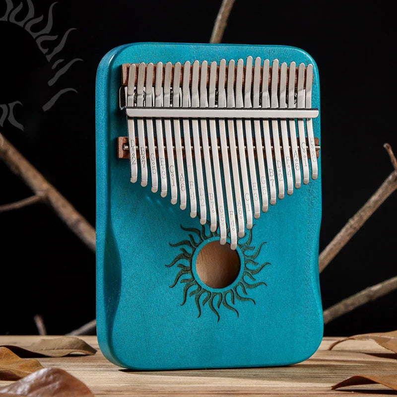 Turquoise hluru kalimba finger piano with silver tines and sun motif musical instrument mbira for beginner music lovers
