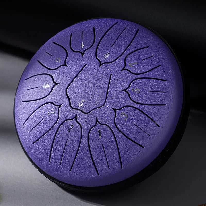 Purple hluru glucophone steel tongue drum with numbered leaf-shaped sound chambers for yoga meditation percussion