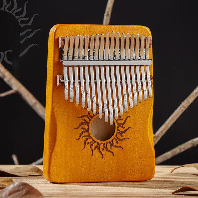 A warm orange hluru kalimba key kalimba finger piano solid maple wood thumb piano keyboard with sun motif engraving