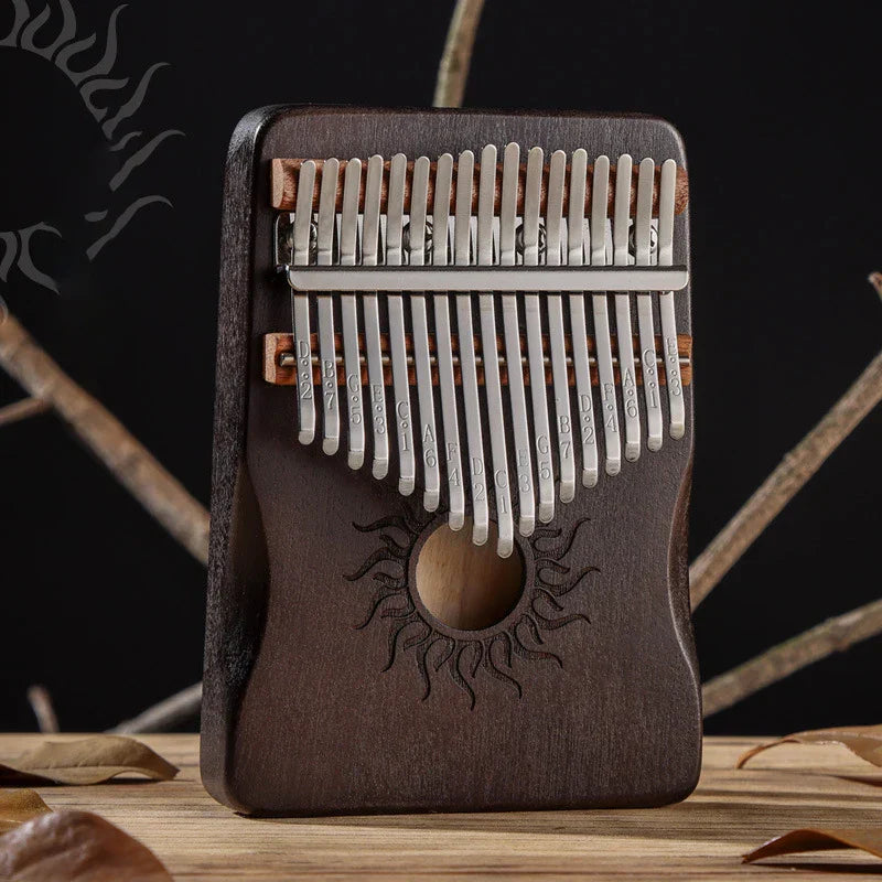 Dark brown hluru key kalimba finger piano solid maple wood with silver tines and sun motif thumb piano keyboard