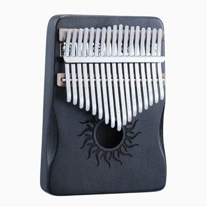 Black wooden Hluru kalimba finger piano with silver metal tines and sun motif for beginner music lover gifts