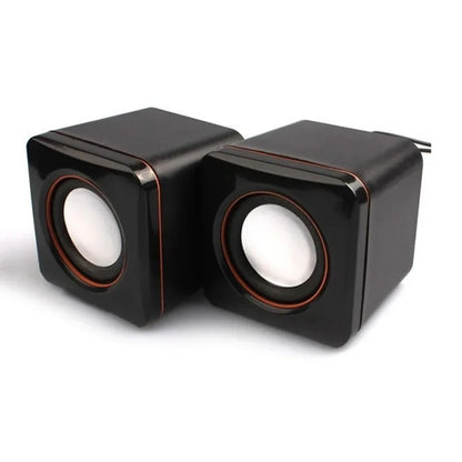 Black cube shaped speaker mini usb powered dual stereo speaker system with glossy finish and red accent rings