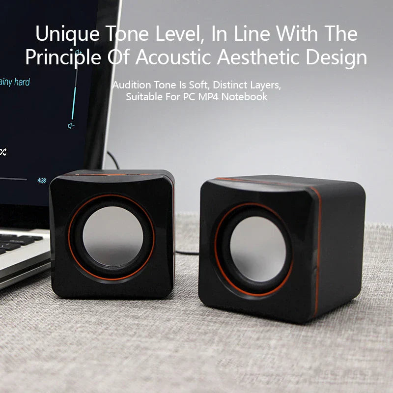Black cube-shaped speaker mini usb powered dual stereo speaker with orange-accented drivers for desktop use