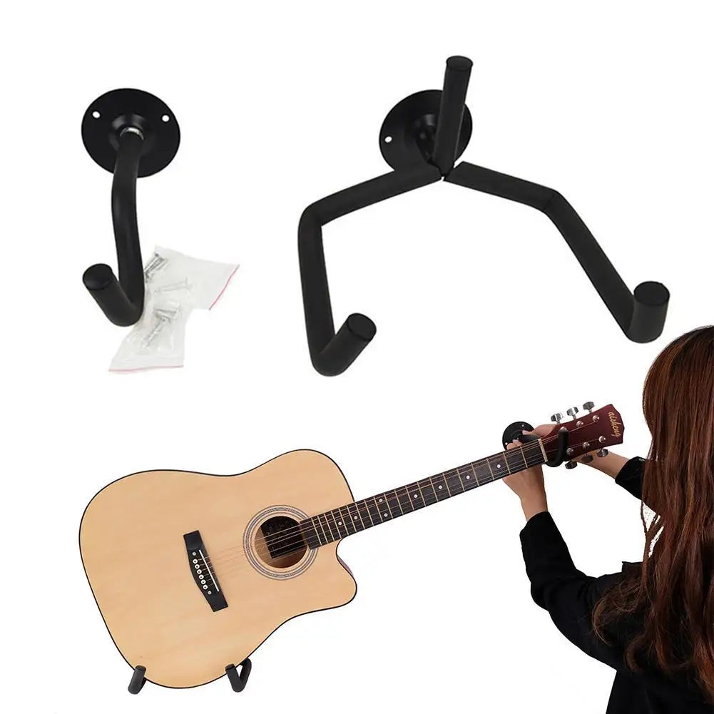Black metal horizontal metal guitar wall mount with curved arms and circular plate for acoustic guitar bass and mandolins slat display