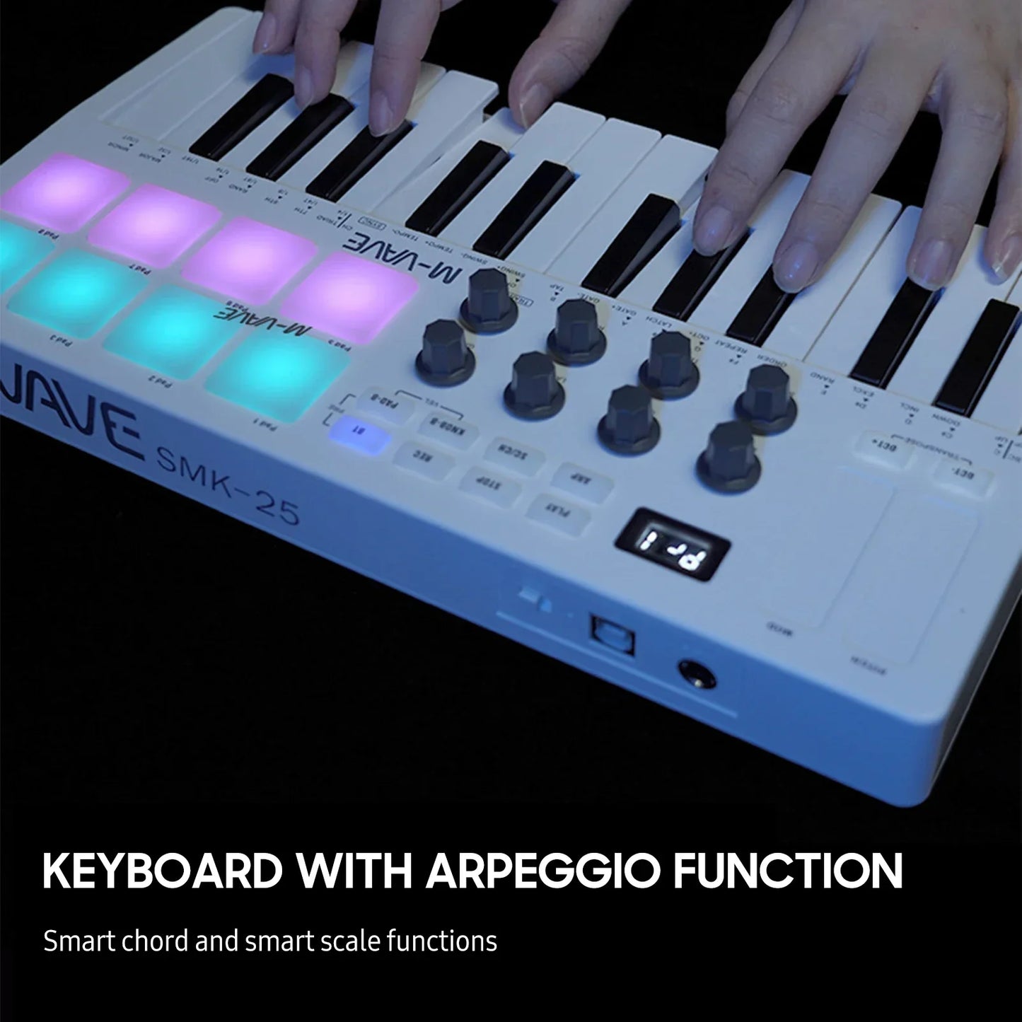 White m-audio smk-25 midi control keyboard with 25 velocity sensitive keys and rgb backlit purple and teal pads