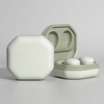 A sleek sage green and off-white my001 mini wireless charging case holding minimalist earbuds for comfortable gaming music and sleep hd noise reduction