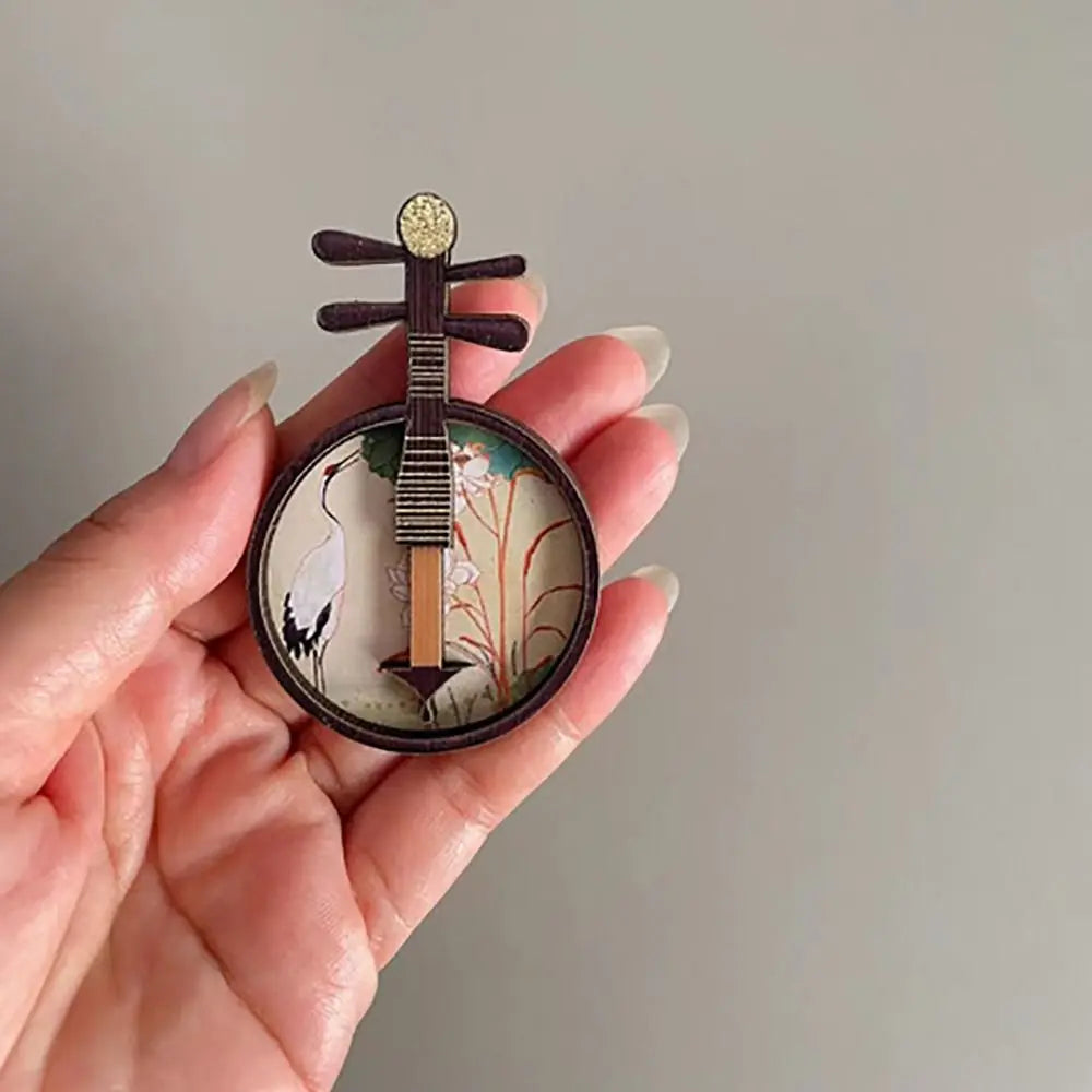 Delicate black wooden mandolin-shaped pin with painted white crane and lotus flowers for dollhouse musical instruments courtesan pattern