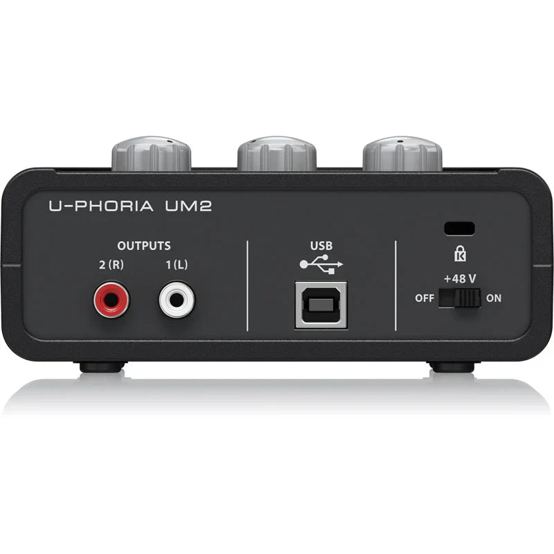 Black behringer um2 usb audio interface with silver knobs rca outputs usb port and phantom power switch for live recording