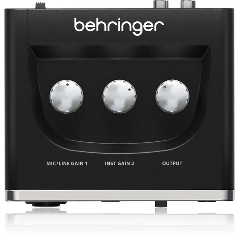 Black behringer umc202hd microphone amplifier usb audio interface with three silver gain knobs for live recording use