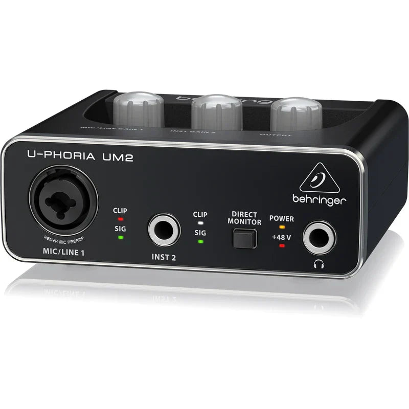 Black behringer umc202hd microphone amplifier usb audio interface with silver trim and multiple input output ports for live recording