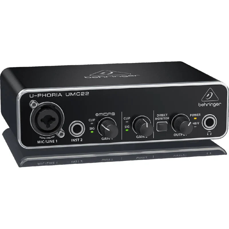 Black behringer u-phoria umc22 usb audio interface with silver trim and multiple input output ports for microphone amplifier live use