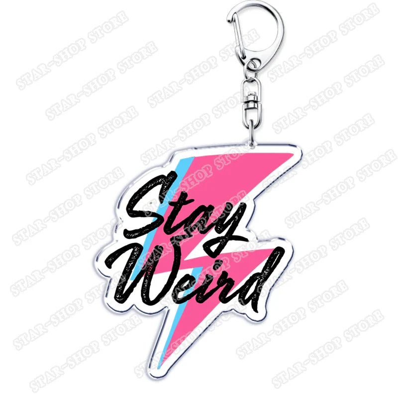 A vibrant pink and light blue lightning bolt-shaped acrylic elements keychain accessories with stay weird for byers eleven mike fans