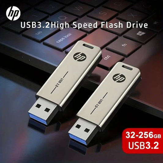 Two sleek silver hp metal usb3.2 flash drives with blue connectors and black logos on dark keyboard surface drive 32gb 64gb pendrive 128gb 256gb creative personality