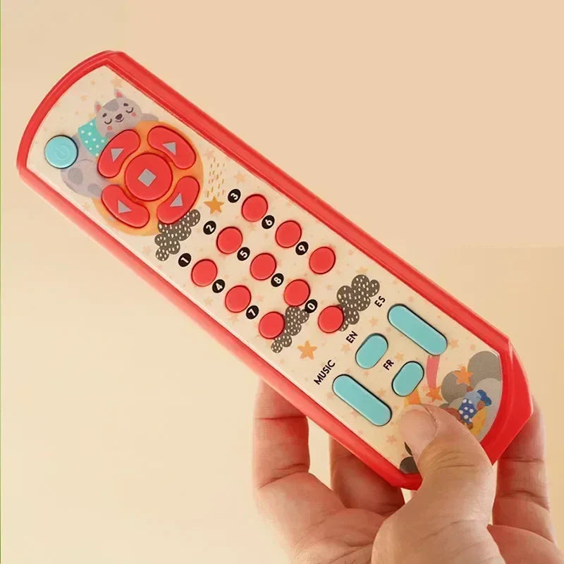 Red plastic toy sensory remote with music and light features and cartoon cat decals for infant simulation tv remote play