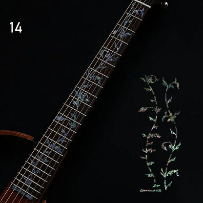 A sleek black electric guitar featuring ornate iridescent mother-of-pearl fretboard sticker guitarra with stickers cross inlay