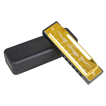 Golden hohner harmonica with silver engraving and black casing beside its case colorful c key harmonica woodwind instrument
