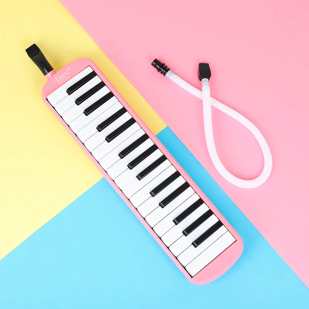 Pink plastic keys melodica musical instrument harmonica with black and white keys detachable white tubing carrying bag mouthpiece