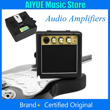 Black compact audio amplifier pg-5 with gold control panel, a box black audio loud musical instrument amplifier