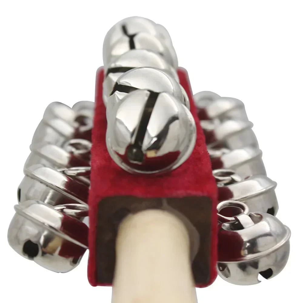 A shiny silver jingle bell set attached to a red velvet holder with wooden handle for irins bell rod orff stick shaker musical children kids gifts