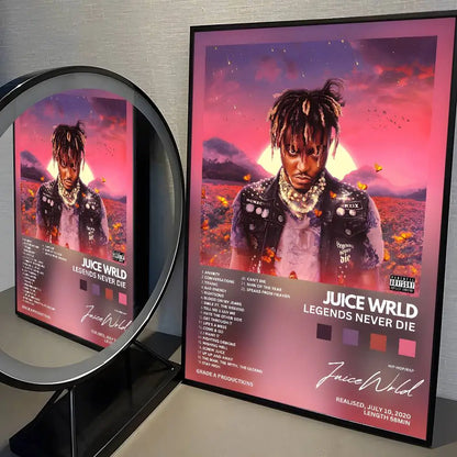 A framed wrld hip hop album poster painting with juice wrld in black jacket against pink purple sunset backdrop