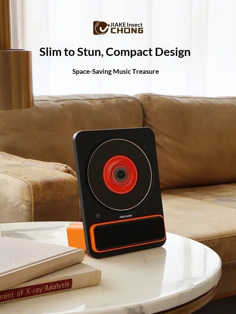 Black and orange jaek audio c30 machine phonograph record with circular red center album player hifi speaker