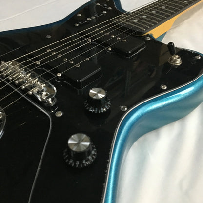 Glossy black and teal jazzmast electric guitar with chrome hardware and rosewood fingerboard shown from front angle