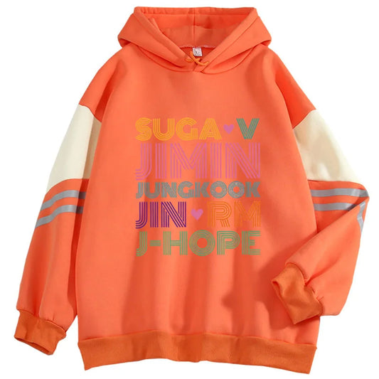 A vibrant orange fashion kpop hoodie with cream sleeves and colorful jimin jung kook graphic print for women fashion kpop