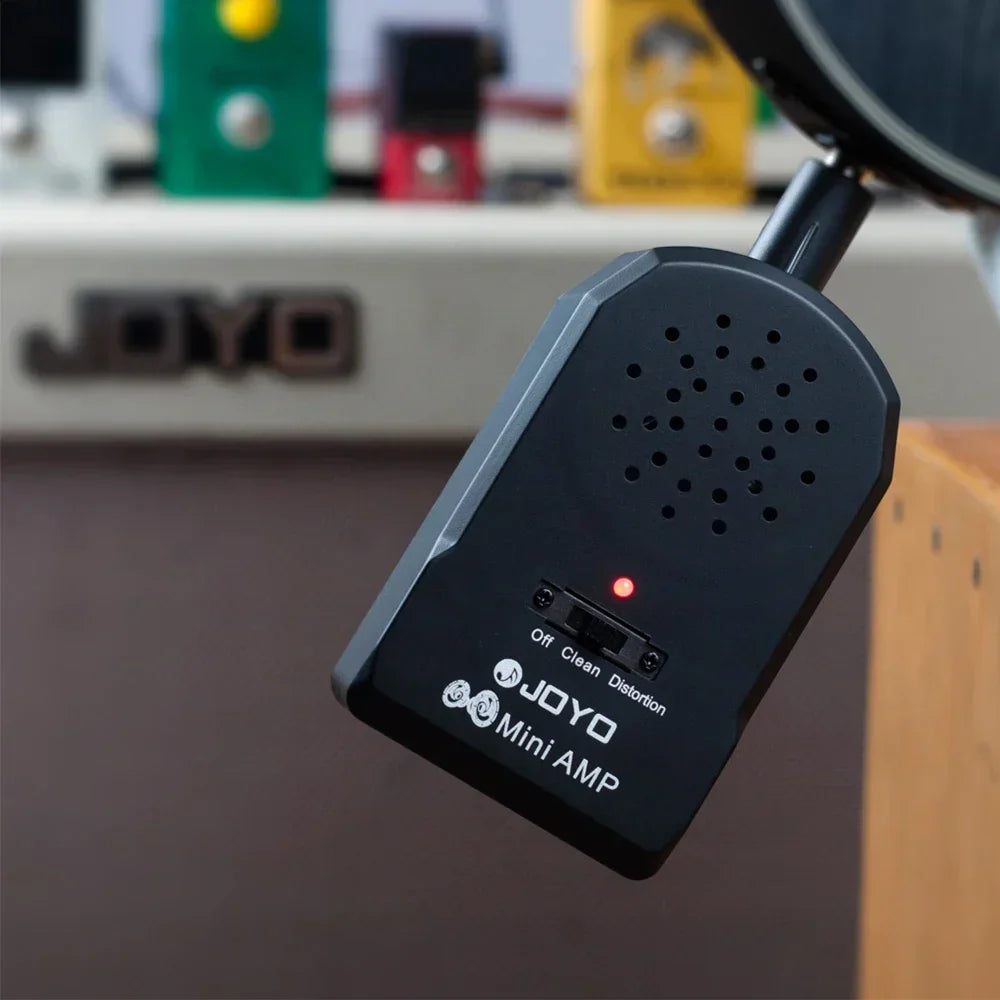 Black joyo guitar amplifier amp headphone with red indicator light and three switches for clean distortion effect modes
