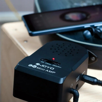 Black joyo guitar amplifier amp headphone with three audio mode switches and red led indicator for clean distortion effect