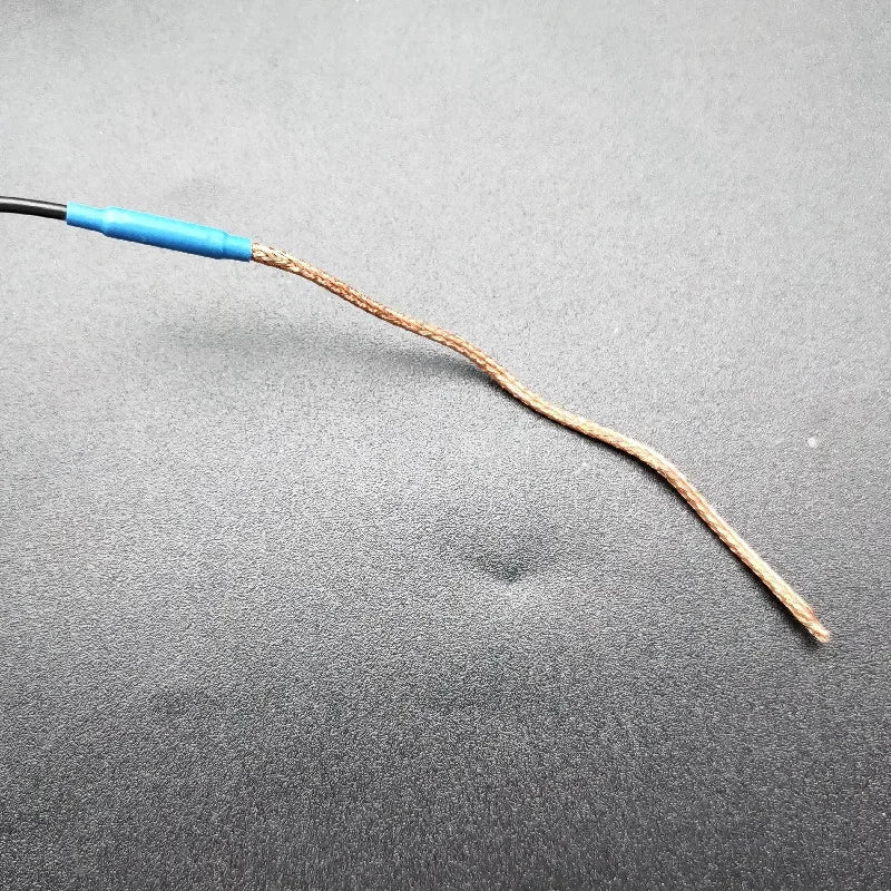 A brown braided wire with a blue insulated connector for joyo je-307 5-band preamp eq with soft piezo black type beat music guitar