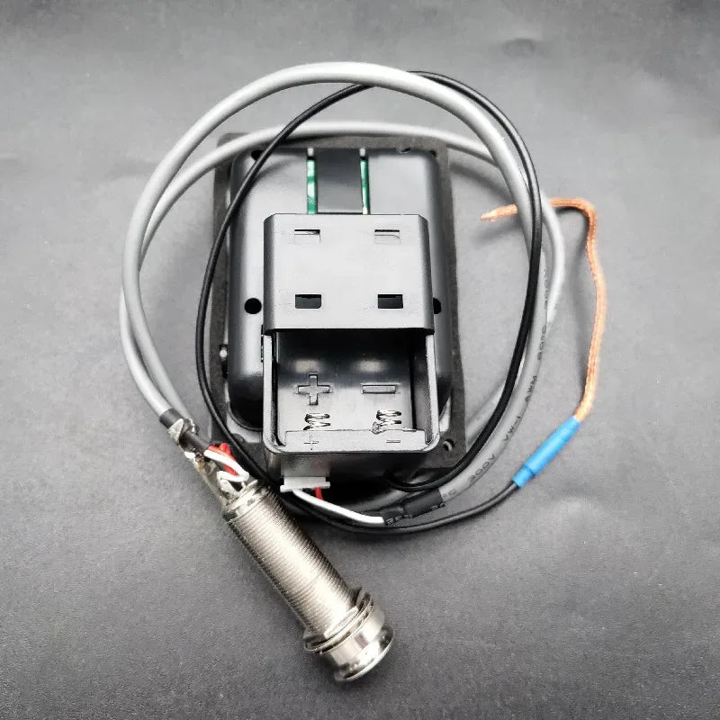 Back side of joyo je-307 5-band preamp eq with tuner featuring a soft piezo black sensor probe and coiled wires for type beat music
