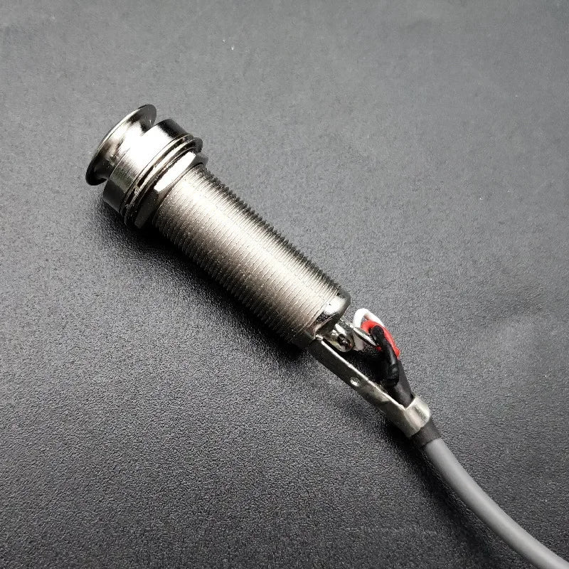 Silver metallic cylindrical sensor with threaded body and attached black cable for joyo je-307 5-band soft piezo black type beat music