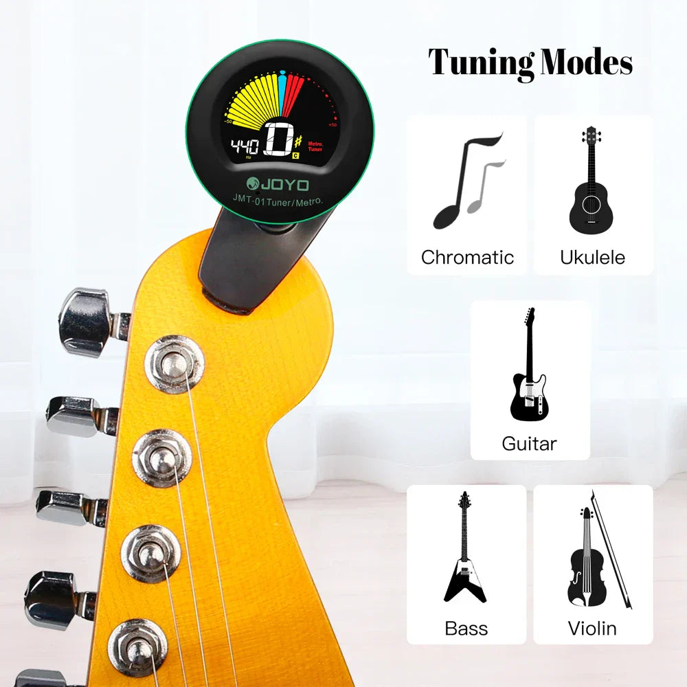 Black and green joyo jmt-01 guitar tuner with colorful display and 360° rotating clip chromatic tuning on yellow neck