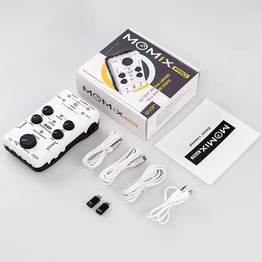 White momix pro audio mixer with black knobs designed for smartphone and pc use for guitar keyboard musical instruments