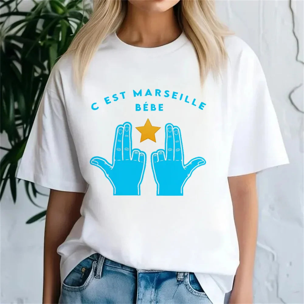 White cotton jul t-shirt female kawaii punk with blue star hands graphic and teal c est marseille bebe text pastel women y2k