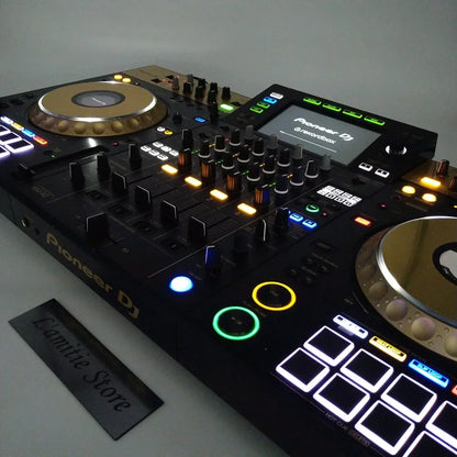 Black pioneer dj xdj-xz controller with gold jog wheels and blue green yellow orange illuminated buttons for type beat music