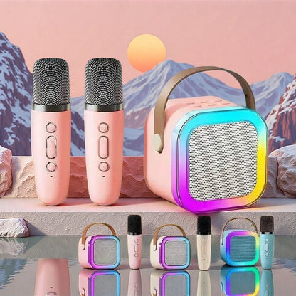 K12 bluetooth portable speaker with pink and rainbow led lights and a carrying handle for karaoke microphone use